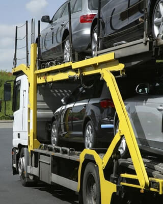 yellow car transporter